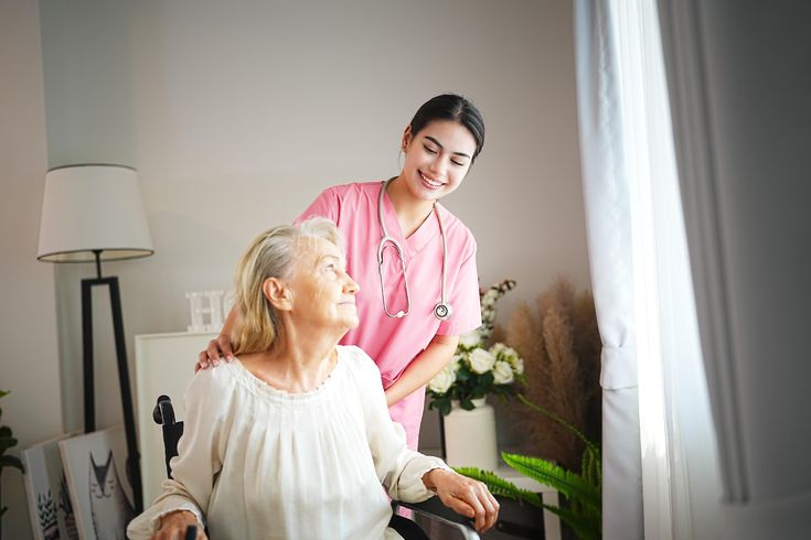 Compassionate home care aide providing companionship to an elderly woman