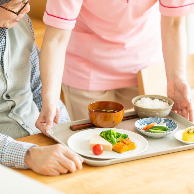Licensed nurse monitoring vital signs during an in-home care visit